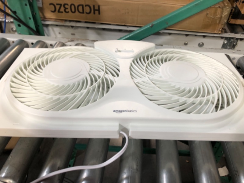 Photo 2 of **Damaged***Amazon Basics Window Fan with Manual Controls, Twin 9-Inch Reversible Airflow Blades