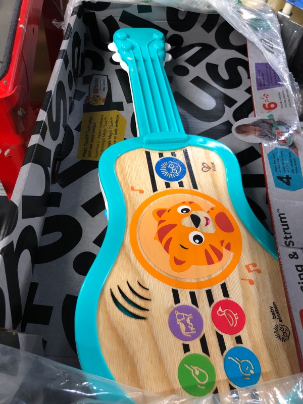 Photo 2 of Baby Einstein Sing & Strum Magic Touch Ukulele Wooden Musical Toy, 