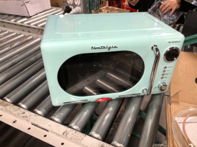 Photo 1 of **SEE NOTES/FOR PARTS**
Nostalgia Retro Compact Countertop Microwave Oven, 0.7 Cu. Ft. 700-Watts Aqua 