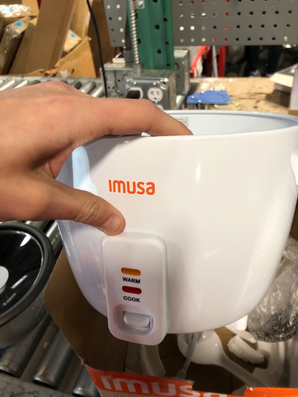 Photo 2 of * broken leg * 
IMUSA USA GAU-00011 Electric Nonstick Rice Cooker 3-Cup (Uncooked) 6-Cup (Cooked), White