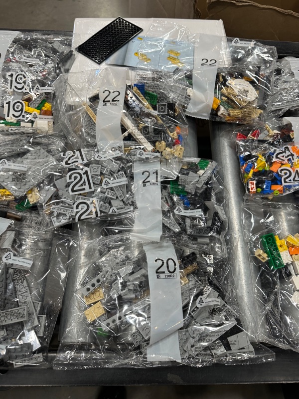 Photo 9 of LEGO Star Wars The Razor Crest 75331 Building Set for Adults (6,186 Pieces) all 48 bags of Legos, all 3 books and 1 platform piece. 