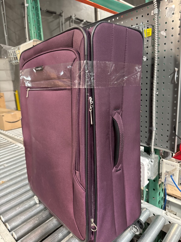 Photo 1 of 28" rolling purple/plum suitcase/luggage