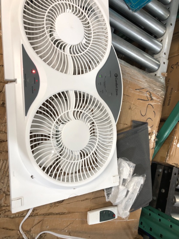 Photo 2 of **NONREFUNDABLE**FOR PARTS OR REPAIR**SEE NOTES**
Comfort Zone CZ310R Adjustable Width 3 Speed Dual Reversible Fan with Remote Control and Removable Cover, White