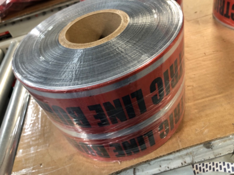 Photo 2 of Detectable Underground Line Tape, Legend "Caution Buried below Line Below", 1000' Length x 6" Width, Red