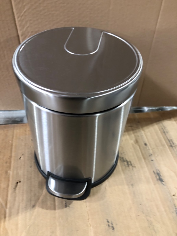 Photo 2 of **item used**item has dents**see images**
Amazon Basics 5 Liter / 1.3 Gallon Round Soft-Close Trash Can with Foot Pedal - Stainless Steel 5L / 1.3 Gallon