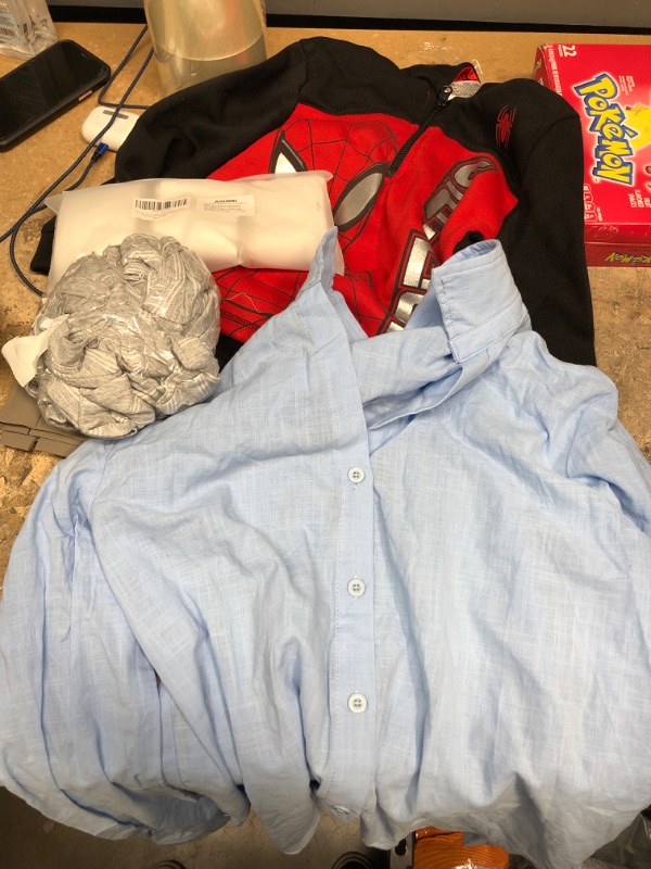 Photo 1 of A bundle of Tube socks/ Grey shirt/ blue button up/ womens shorts/ kids sweater 