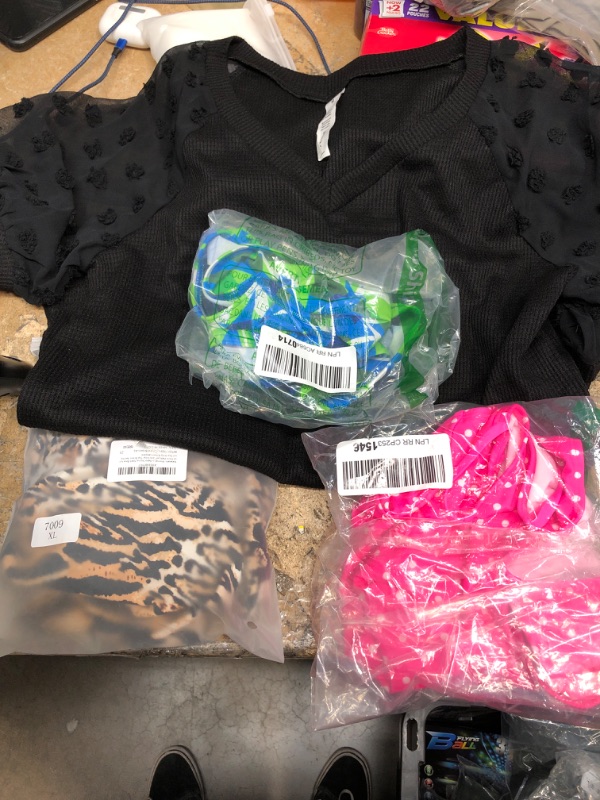 Photo 1 of A bundle of Women’s swim wear and women shirt