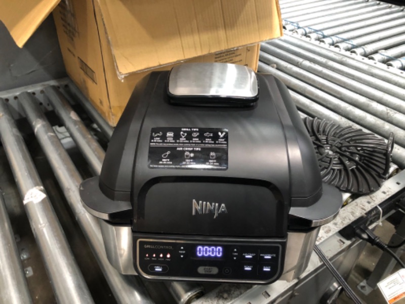 Photo 3 of ***NOT WORKING***SOLD FOR PARTS ONLY****
Ninja AG301 Foodi 5-in-1 Indoor Grill with Air Fry, Roast, Bake & Dehydrate, Black/Silver
