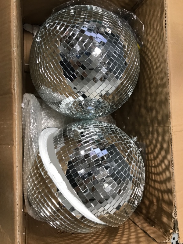 Photo 2 of ***One of them is broken in half as seen in picture.***
2 Pack Large Disco Ball Silver Hanging Mirror Disco Ball Reflective Mirror Disco Ball Ornament for Party Holiday Wedding Dance Music Festivals Decor Club Stage Props DJ Decoration (12 Inch, 12 Inch)