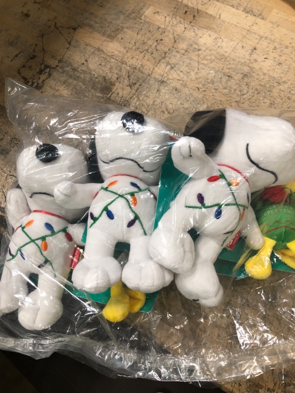 Photo 2 of Peanuts for Pets Snoopy Tangled in Holiday Lights & Woodstock Sweater Holiday Dog Toy Set 2 Pack | Snoopy & Woodstock Plush Squeaky Dog Toys | Peanuts Comics Dog Chew Toys for Dog Christmas Stocking Snoopy Tangled & Woodstock Greetings Assorted PACK OF 3