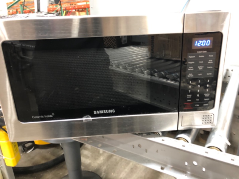 Photo 2 of SAMSUNG 1.1 Cu Ft Countertop Microwave Oven w/ Grilling Element, Ceramic Enamel Interior, Auto Cook Options, 1000 Watt, MG11H2020CT/AA, Stainless Steel, Black w/ Mirror Finish