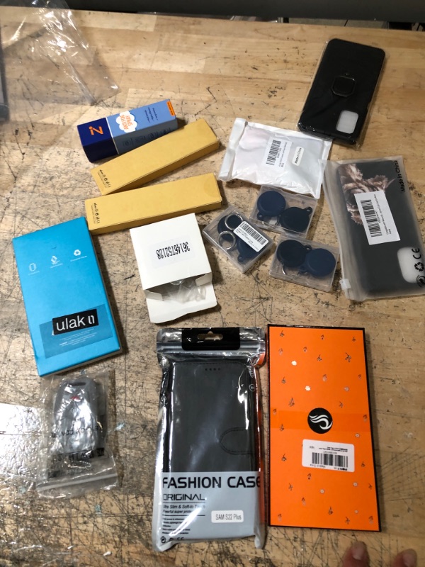 Photo 1 of 12 pack assorted I phone, Moto G, Samsung and airtag items bundle 