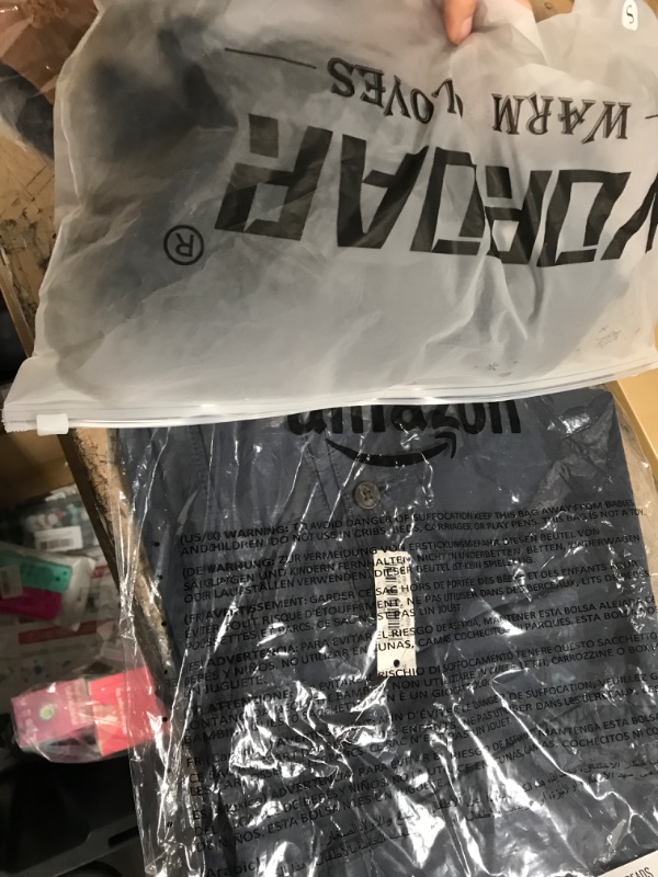 Photo 1 of BUNDLE OF 7 clothing items. Beanie, 2, 3 packs of headbands, 2 small womens tops, gloves, and size 34 mens shorts