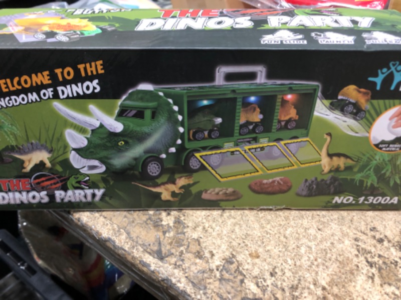 Photo 2 of BLUEJAY 21 Pack Dinosaur Toys for Kids 3-7, Dinosaur Truck with Oversized Dinosaur Map, Flashing Lights, Music and Roaring Sound, Kids Toys with 6 Pull Back Dinosaur Cars, 6 Dinosaur Toys (Green)