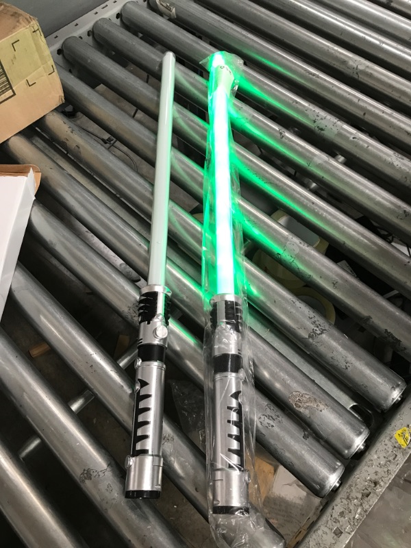 Photo 2 of ***SHORT***JOYIN 2-in-1 Light Up Saber, Sword for Kids, LED Dual Laser Swords Set with FX Sound (Motion Sensitive) and Realistic Sliver Handle for Fighters and Warriors, New Years Eve Party Supplies Kids Stuff Green and Blue