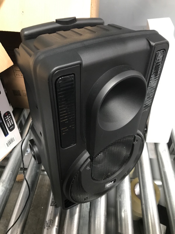 Photo 2 of speaker blowed still plays music just very little *****8’’ Portable PA Speaker System - Wireless BT Streaming PA & Karaoke Party Audio Speaker, Two Wireless Mic, Wired Microphone, Tablet Stand, Flashing Party Lights, MP3/USB//FM Radio - PHPWA8TB 8 inch Sp