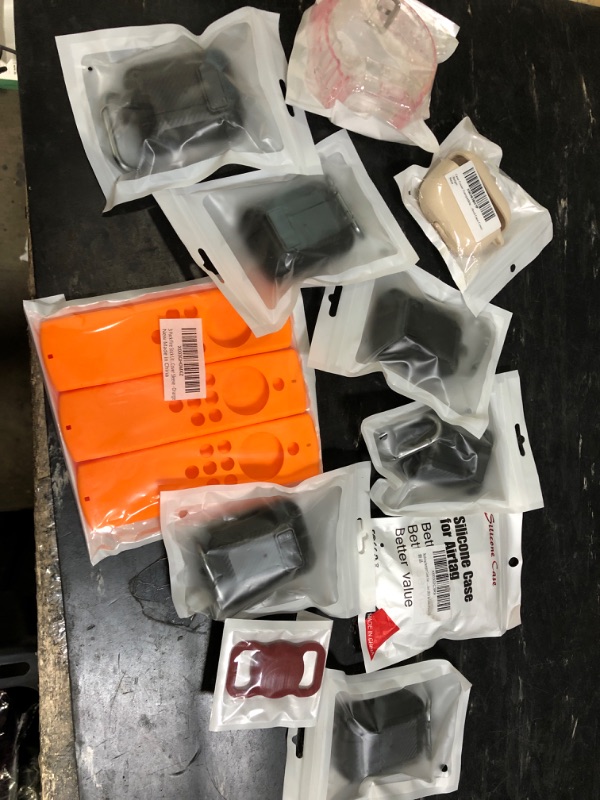 Photo 1 of BUNDLE OF 11 AIRPOD, AIRTAG, RIFESTICK, AND WATCH CASES