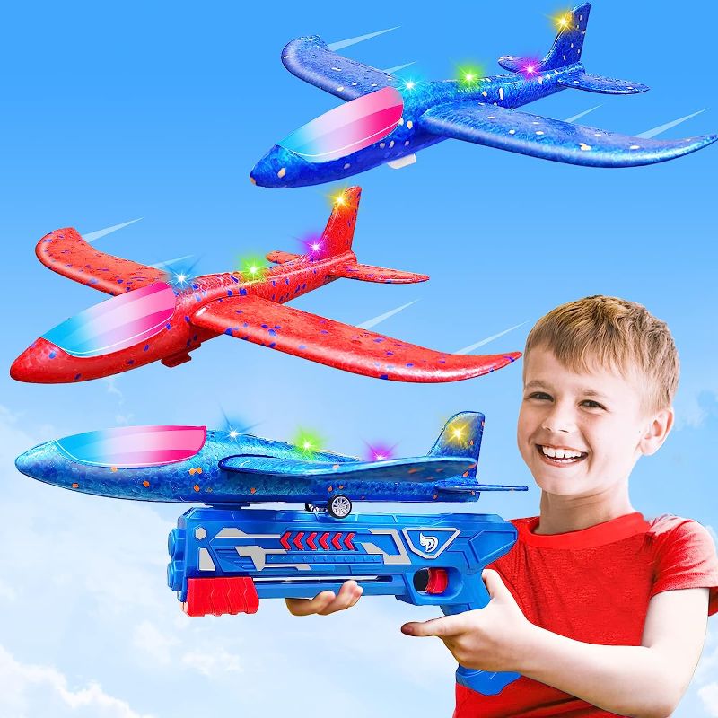 Photo 1 of AMENON 2 Pack LED Flying Airplane Toys with Launcher, Foam Glider Planes Easter Basket Stuffers for Kids Outdoor Flying Toys, Catapult Airplanes for 6-12 Years Old Boys Girls Easter Party Favors
