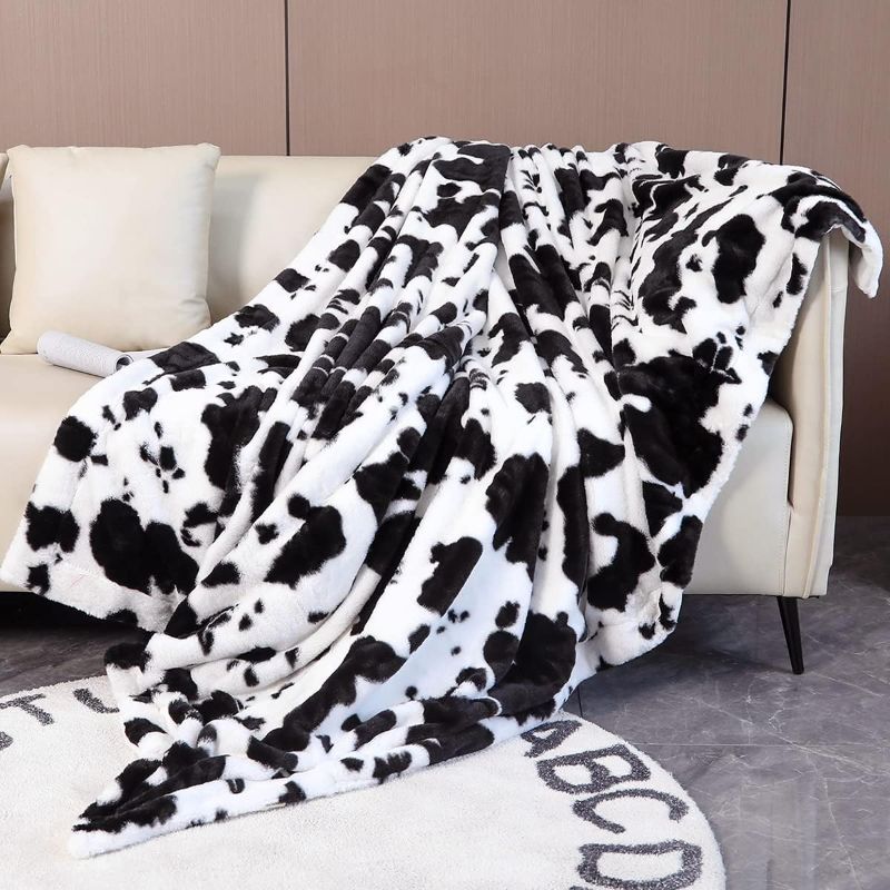 Photo 1 of  Black and White Cow Print Blanket Faux Fur Fleece Cow Blankets for Couch Sofa Western Style Fluffy Furry Throw Blanket for Kids Boys Girls Adults..