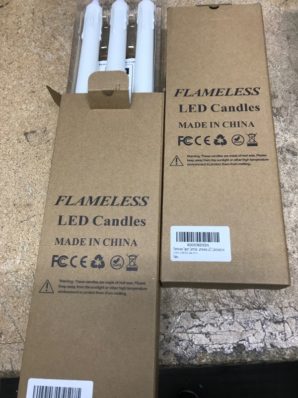 Photo 2 of  2 pack* Flameless Taper Candles Battery Operated Led Taper Candles Flickering Flame With Remote Electric Window Candles Christmas Home Wedding Decor Flameless LED Candlesticks 3 Pack 11 Inch White Real Wax