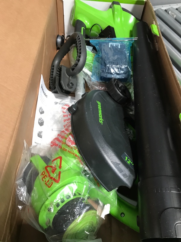 Photo 2 of **USED**  Greenworks 24V Cordless String Trimmer and Blower Combo Pack with Extra Replacement Spools, 2Ah Battery and Charger Included