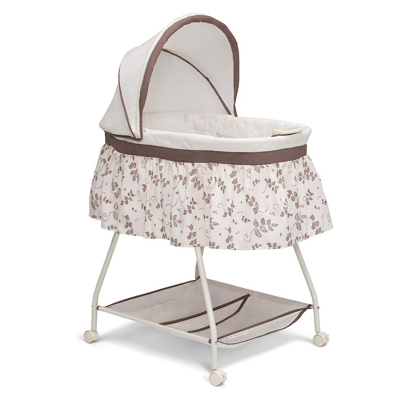 Photo 1 of Delta Children Deluxe Sweet Beginnings Bedside Bassinet - Portable Crib with Lights and Sounds, Falling Leaves
