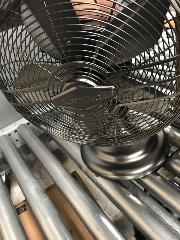 Photo 2 of Lasko 12" Classic Metal Table Fan - 12" Diameter - 3 Speed - Quiet, Carrying Handle, Oscillating - 17.3" Height x 13.3" Width - Metal