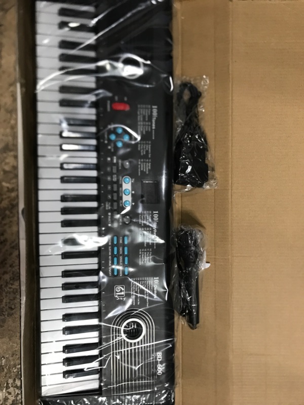 Photo 2 of ADMUSIC MINI 61 KEYBOARD ELECTRONIC