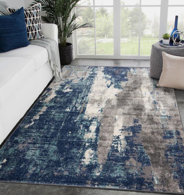 Photo 1 of **MINOR WEAR & TEAR**LUXE WEAVERS Modern Area Rugs with Abstract Patterns 7681 Medium Pile Area Rug, Dark Blue, Light Blue, 5' x 7'
