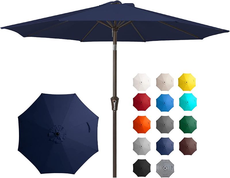 Photo 1 of **MINOR WEAR & TEAR**JEAREY 9FT Outdoor Patio Umbrella Outdoor Table Umbrella with Push Button Tilt and Crank, Market Umbrella 8 Sturdy Ribs UV Protection Waterproof for Garden, Deck, Backyard, Pool (Navy Blue)
