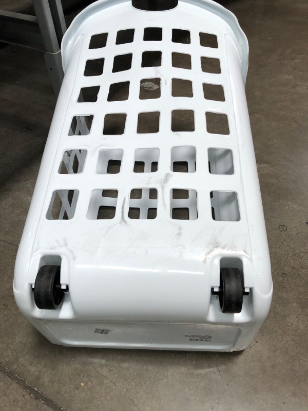 Photo 3 of **MINOR SHIPPING DAMAGE**United Solutions Rolling Hamper with Built-In Handle, Two Bushel Capacity Holds 3 Loads of Laundry, Smooth-Gliding Thermo-Rubber Wheels, White, Ventilated Design