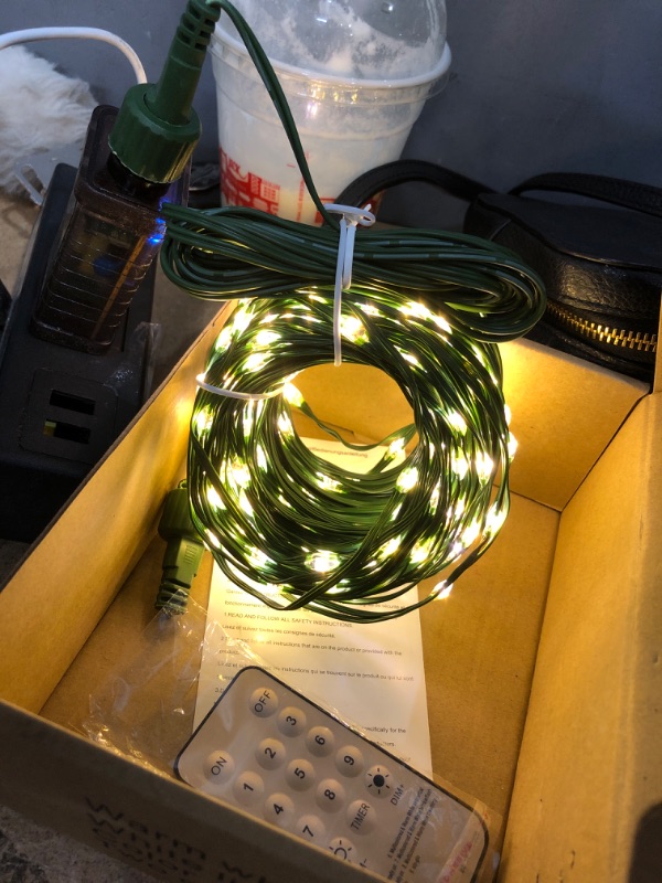 Photo 2 of **TESTED/ TURNS ON** TOUBIK 300 LED Christmas Lights Outdoor Indoor,110Ft 8 Modes Warm White & Multicolor End-to-End Connectable Fairy String Light Plug in for Xmas Tree Party Wedding Outside Decorations Warm White & Multicolor 300LEDS