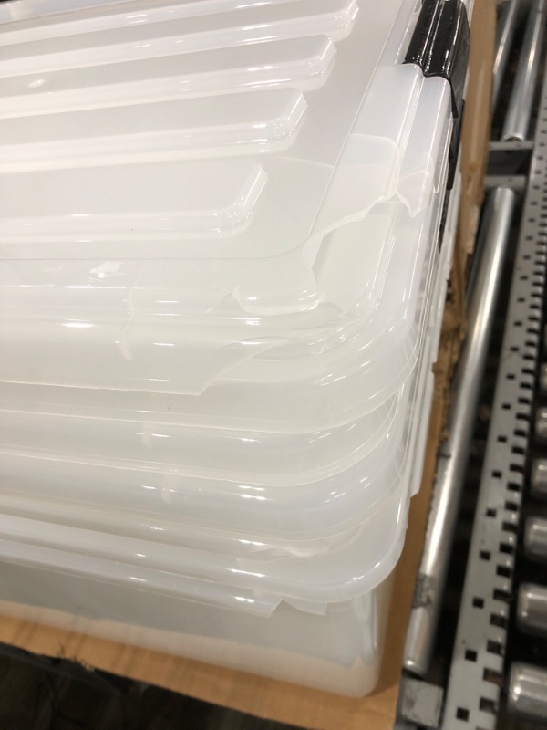 Photo 3 of "CRACKS ON 2 OF THE LIDS AND ONE OF THE BINS" IRIS USA 91 Quart Large Storage Bin Utility Tote Organizing Container Box with Buckle Down Lid for Clothes Storage, 4 Pack, Clear, Clear/Black (500184) h) 91 Qt. - 4 Pack