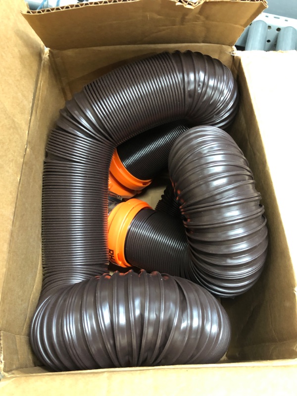 Photo 2 of Camco RhinoFLEX RV Sewer Hose Kit with Swivel Transparent Elbow and 4-in-1 Dump Station Fitting, Brown, 15 Feet (39770) 15ft Sewer Hose Kit Frustration-Free Packaging