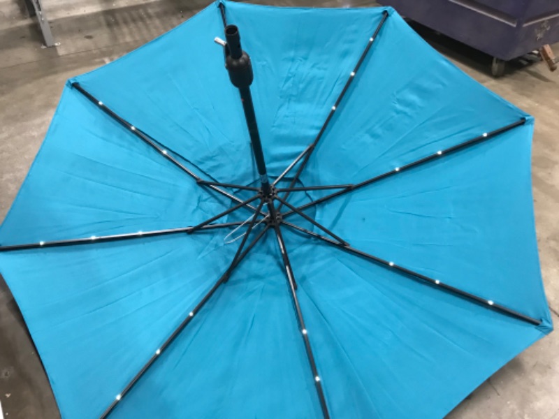 Photo 4 of Sunnyglade 9' Solar LED Lighted Patio Umbrella with 8 Ribs/Tilt Adjustment and Crank Lift System (Teal Blue)
