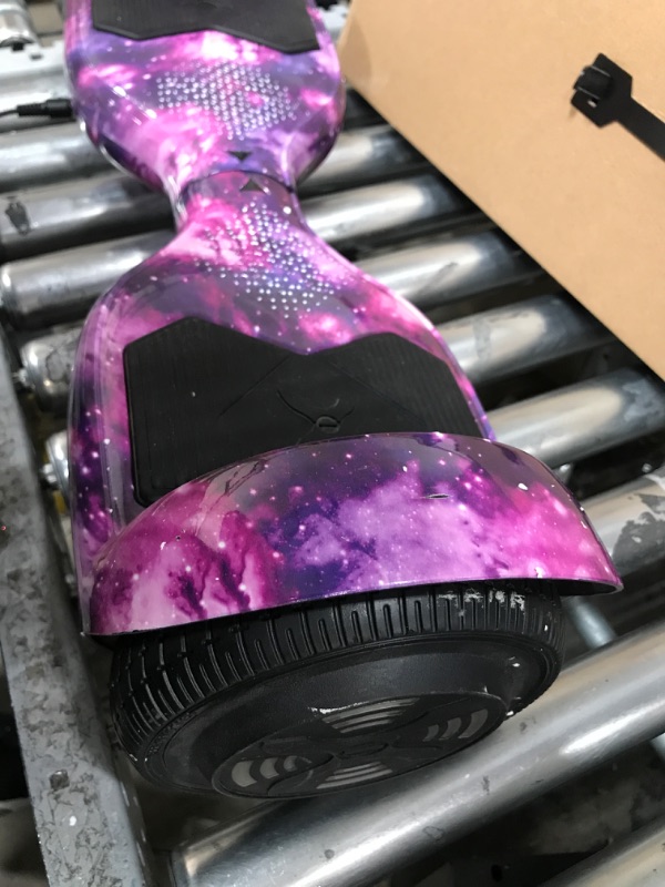 Photo 5 of *** FOR PARTS ONLY*** Hover-1 Helix Electric Hoverboard | 7MPH Top Speed, 4 Mile Range, 6HR Full-Charge, Built-in Bluetooth Speaker, Rider Modes: Beginner to Expert Hoverboard Galaxy DOES NOT WORK CHARGER IS CONNECTED BUT DOES NOT GIVE POWER  