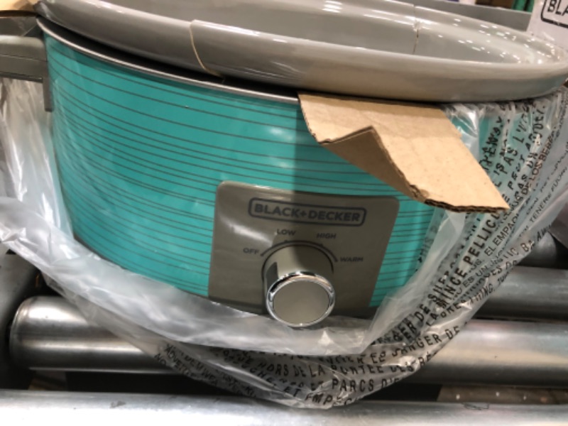 Photo 3 of **bowl is cracked**
BLACK+DECKER 7 Quart Dial Control Slow Cooker with Built in Lid Holder, Teal Pattern, SC2007D