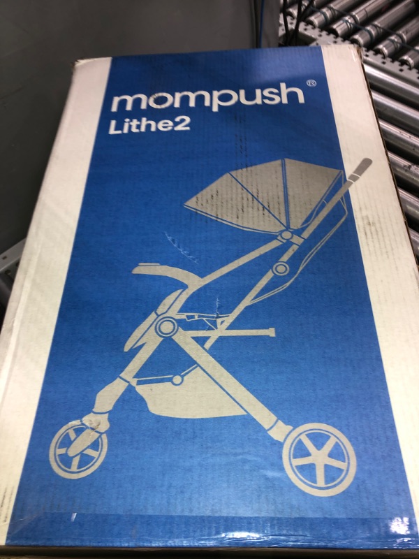 Photo 1 of Mompush Lithe V2 Lightweight Stroller + Snack Tray, Ultra-Compact Fold & Airplane Ready Travel Stroller, Near Flat Recline Seat, Cup Holder, Raincover & Travelbag Included Grey