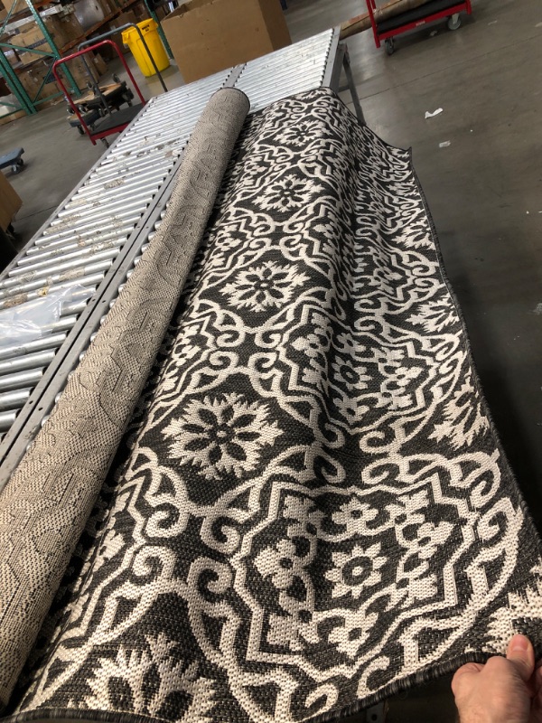 Photo 1 of **USED** Large Black and White Rug, unspecified dimensions 
