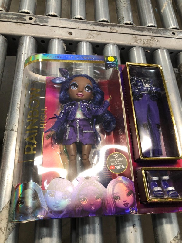 Photo 2 of Rainbow High Krystal Bailey – Indigo (Dark Purple) Fashion Doll with 2 Outfits to Mix & Match and Accessories, Great Gift and Toy for Kids 6-12 Years Old