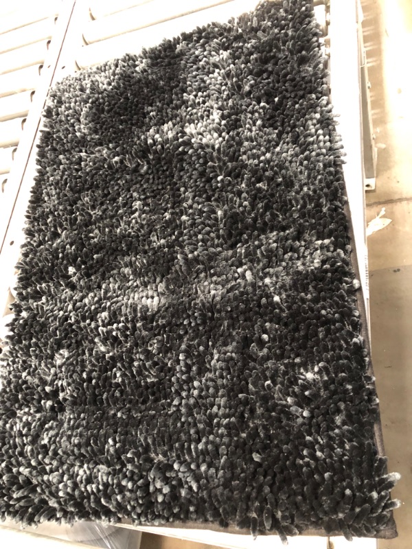 Photo 1 of (30"X20") BLACK RUG 