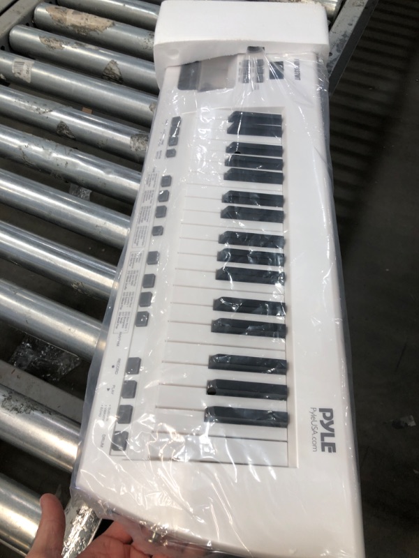 Photo 2 of **USED** Pyle Portable Piano Keytar Electric Keyboard 37 Keys w/Microphone & Carry Strap, Sustain Controller, Rechargeable Battery - Digital Karaoke Keyboard - Compact Musical Piano White - PKBRD37WT