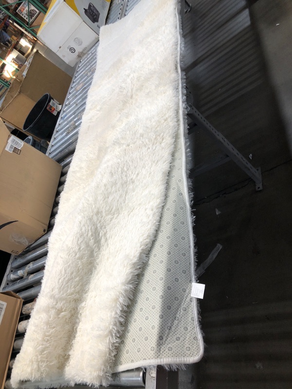 Photo 1 of **USED** Large Fluffy White Rug- 96"x60" (Approximately)