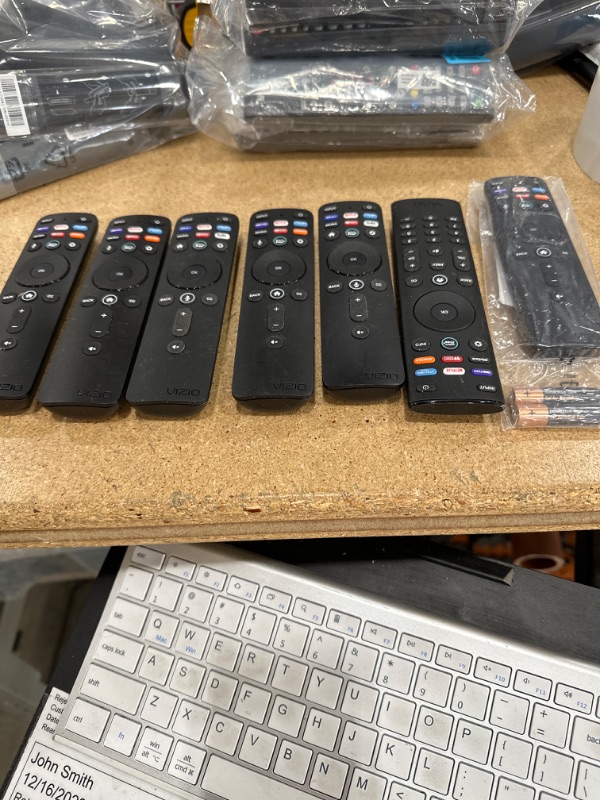 Photo 1 of BUNDLE OF 7 VIZIO REMOTES.