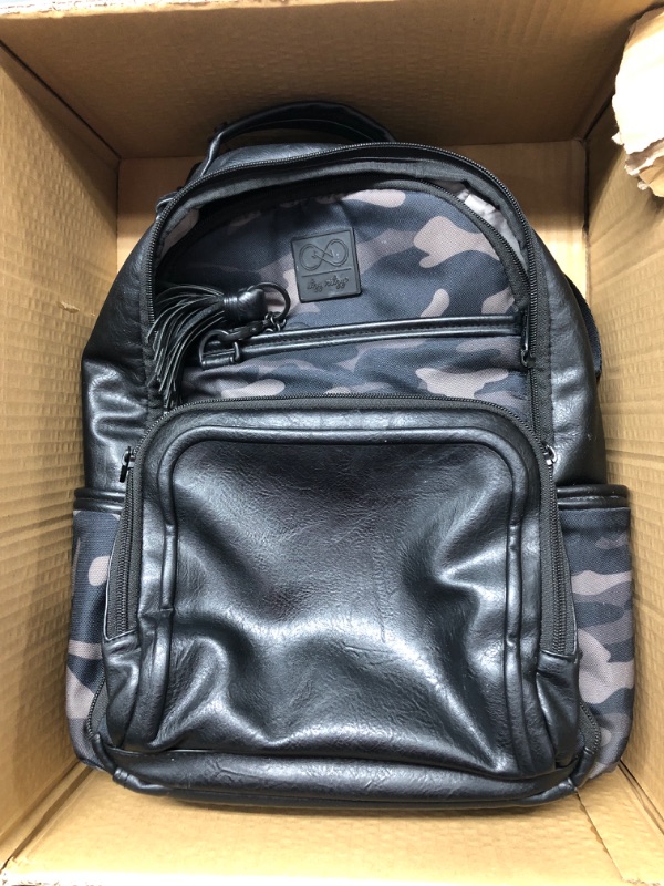 Photo 2 of Chelsea + Cole for Itzy Ritzy Diaper Bag Backpack - Large Capacity Boss Backpack Diaper Bag; Includes Changing Pad, Stroller Clips and Tassel, Camo with Stag Head Print Interior and Black Hardware