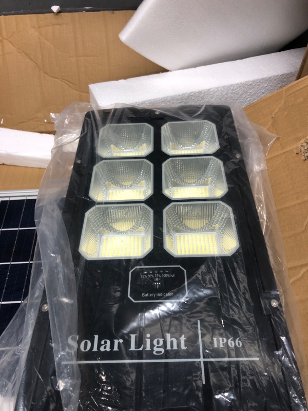 Photo 2 of ** UNTESTED **   HYKOONT 1000W Solar Street Lights Outdoor 60000 Lumens Dusk to Dawn Waterproof IP66 Motion Sensor Street Lights Solar Powered with Remote Control for Parking Lot, Stadium, Pathway