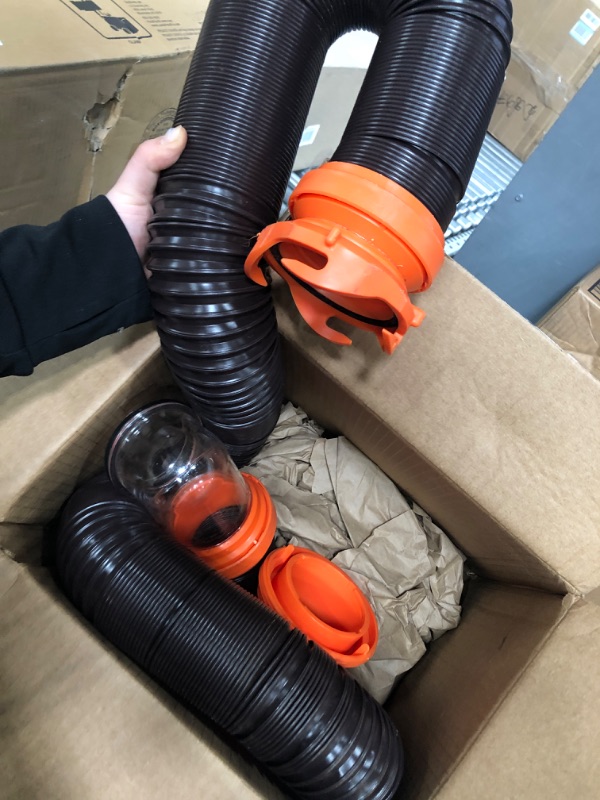 Photo 3 of Camco RhinoFLEX RV Sewer Hose Kit with Swivel Transparent Elbow and 4-in-1 Dump Station Fitting, Brown, 15 Feet (39770) 15ft Sewer Hose Kit Frustration-Free Packaging