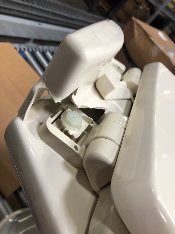 Photo 3 of CRACKED LID/BACK HINGE PLATE***Dometic 302310033 310 Series Standard Height Toilet 19.75" Height, Slow Close Wood Seat, Bone Bone Standard Height Toilet