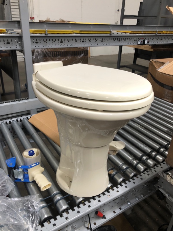 Photo 2 of CRACKED LID/BACK HINGE PLATE***Dometic 302310033 310 Series Standard Height Toilet 19.75" Height, Slow Close Wood Seat, Bone Bone Standard Height Toilet