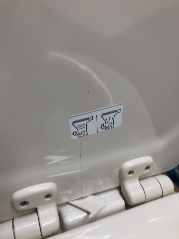 Photo 4 of CRACKED LID/BACK HINGE PLATE***Dometic 302310033 310 Series Standard Height Toilet 19.75" Height, Slow Close Wood Seat, Bone Bone Standard Height Toilet